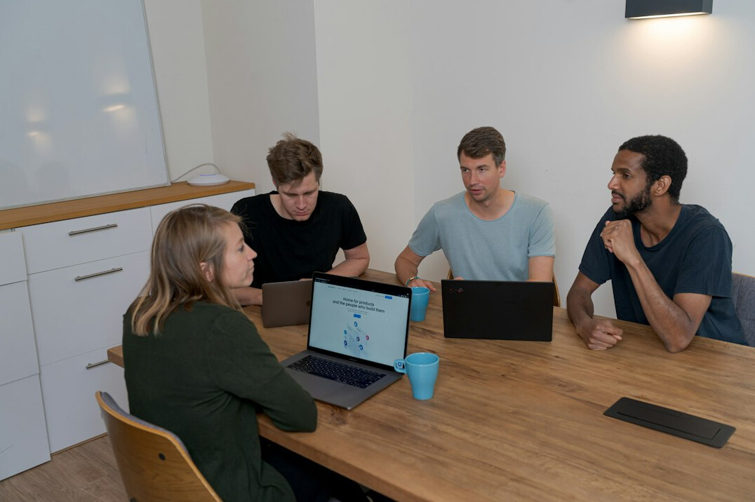 group of students discussing code