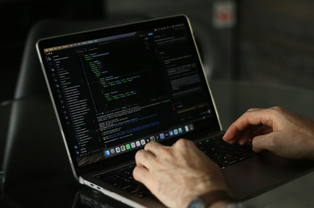 hands typing on keyboard